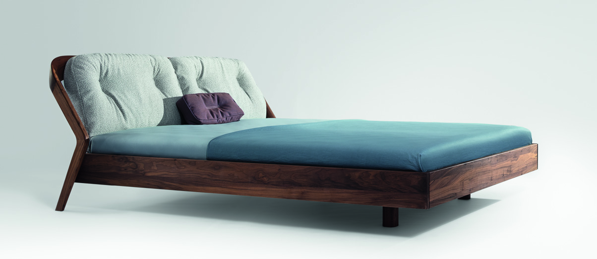 Solid wood bed with upholstered back